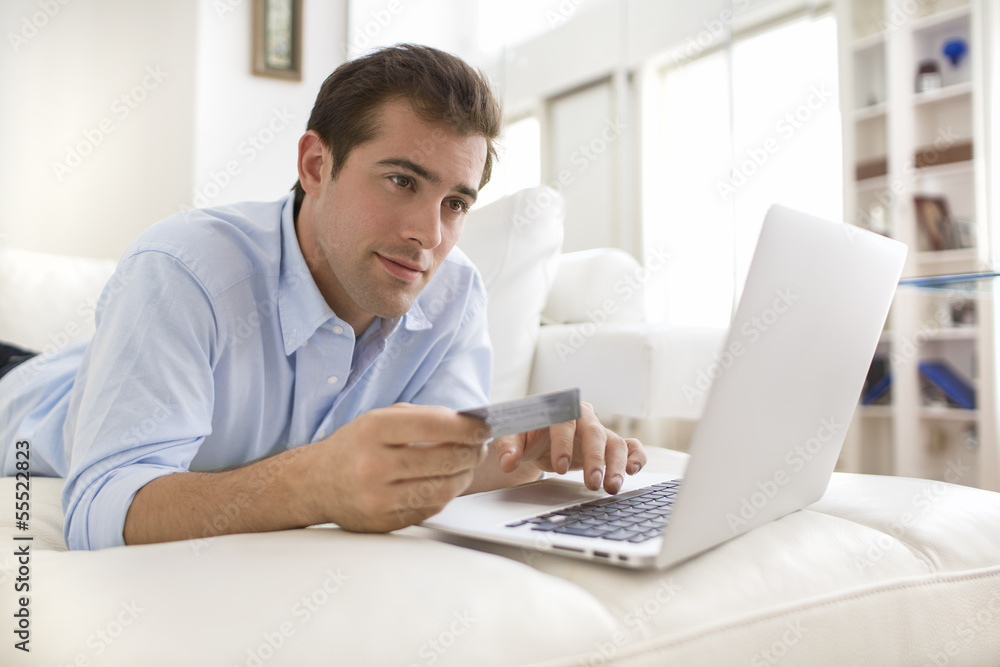 Man using credit card and laptop, shopping online Man using credit card and laptop, shopping online