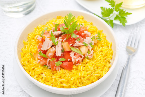 saffron rice with tuna, tomatoes, peppers and herbs in bowl