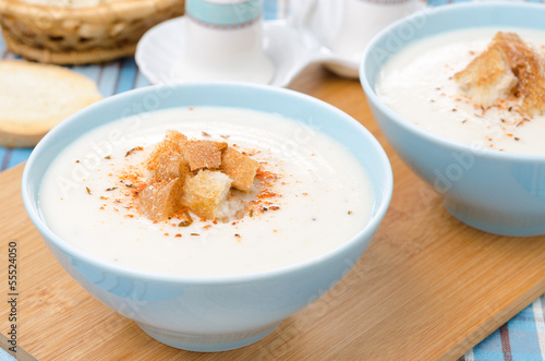 two bowls of cold cauliflower soup with cottage cheese