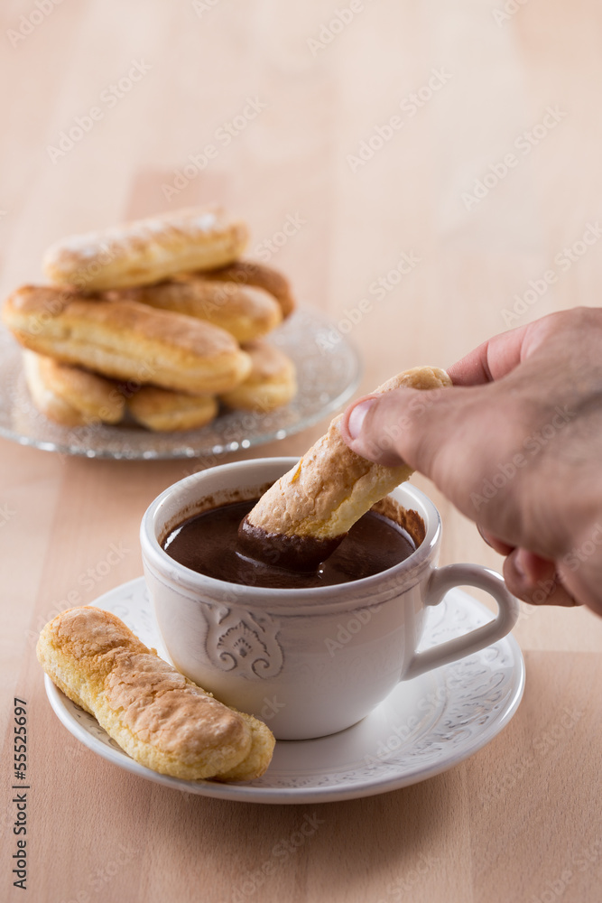 Chocolate cup with whipped cream and ladyfingers