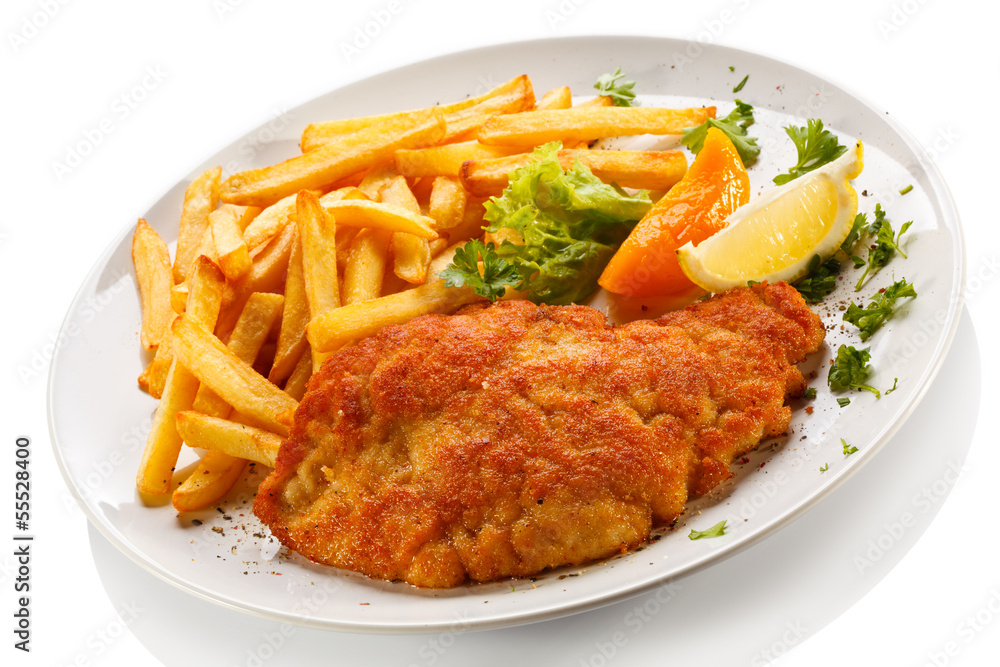 Pork chop, French fries and vegetables Pork chop, French fries and vegetables