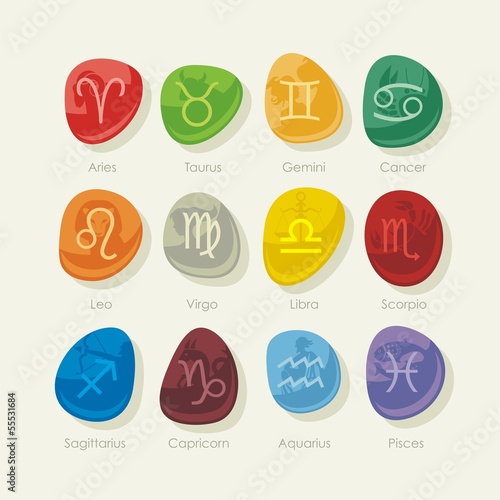 Pebbles set with zodiac signs and symbols