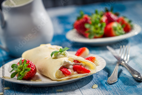 Pancakes with strawberries and whipped Cream