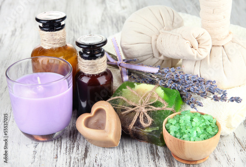 Fototapeta Naklejka Na Ścianę i Meble -  Still life with lavender candle, soap, massage balls, bottles,