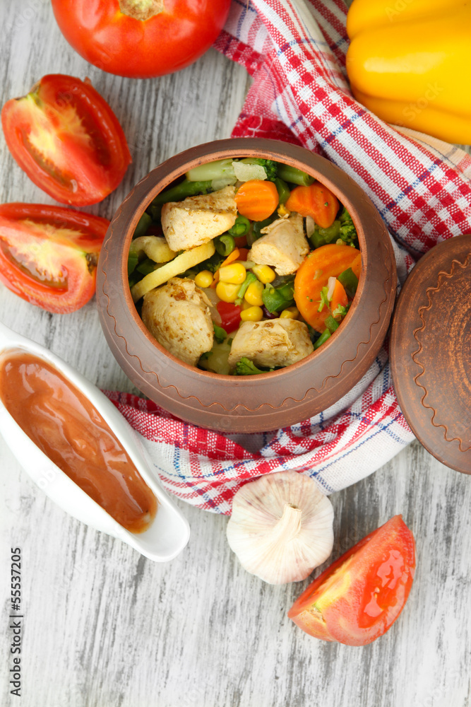 Baked mixed vegetable with chicken breast in pot,