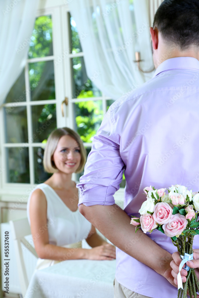 Handsome man with bouquet roses for his girlfriend Handsome man with bouquet roses for his girlfriend