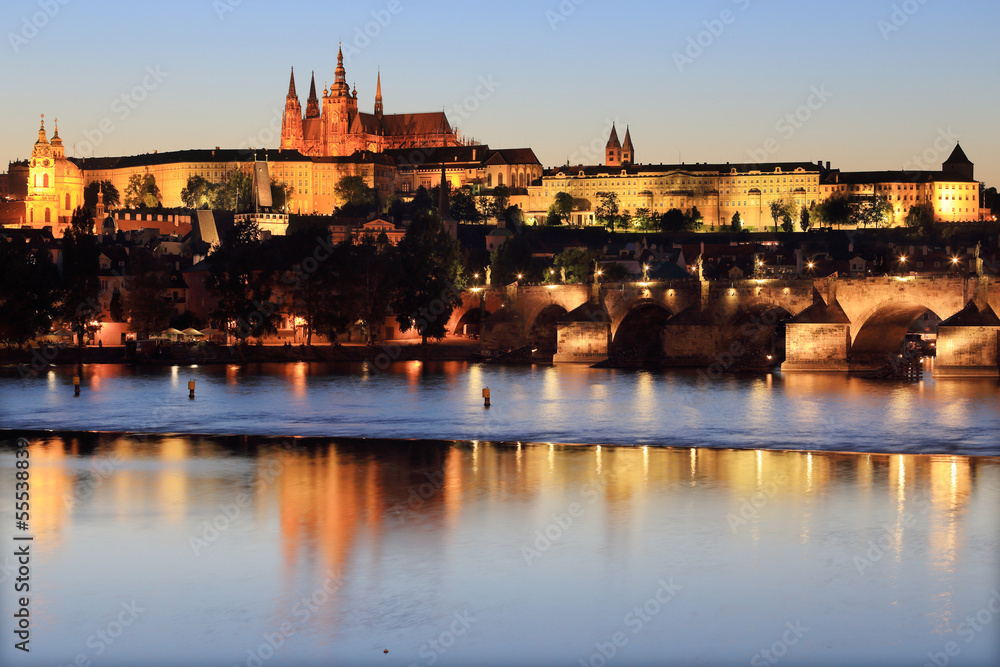 Prague gothic Castle with Charles Bridge after sunset