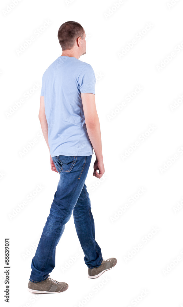 Back view of going handsome man in jeans Back view of going handsome man in jeans