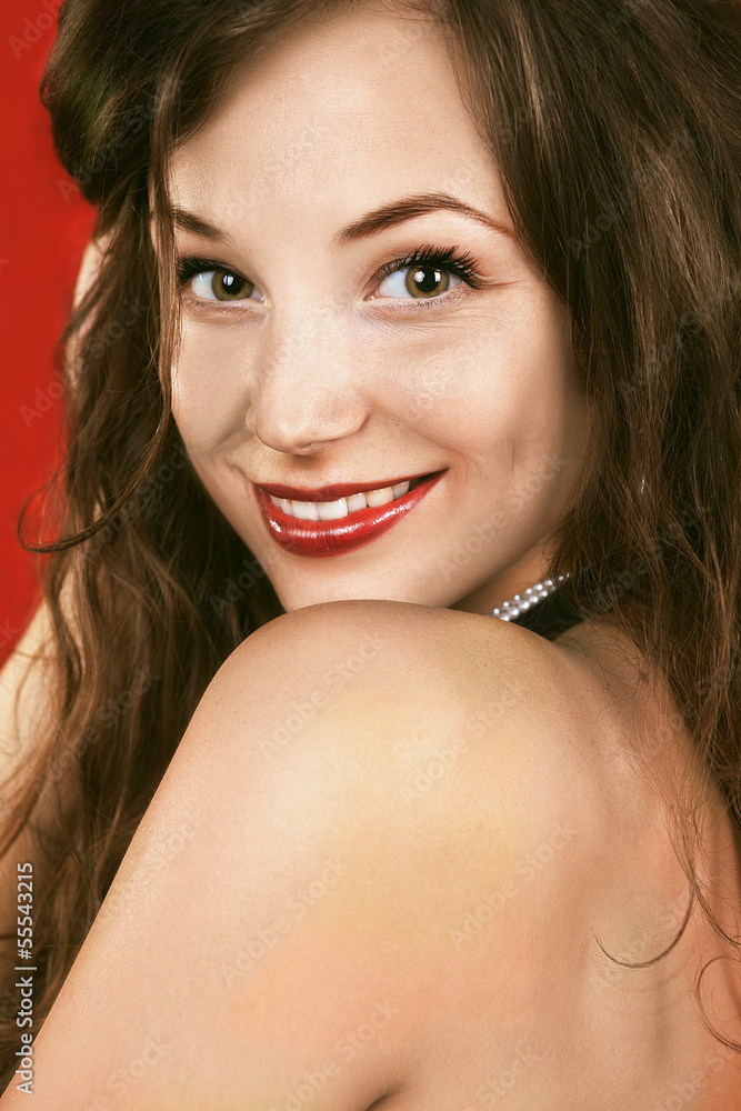 Smiling Glamour girl portrait on red background Smiling Glamour girl portrait on red background