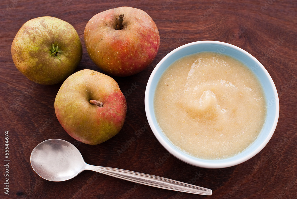 apples and apple sauce on wooden background apples and apple sauce on wooden background