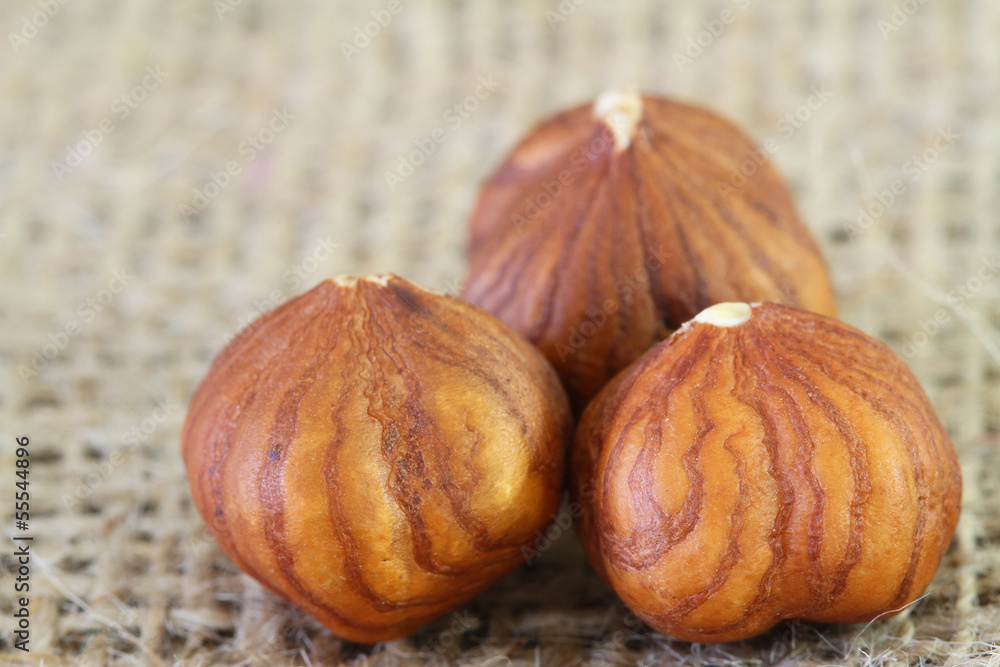 Hazelnut without shell on jute sufrace, close up