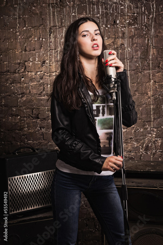 Rock babe singing into a microphone