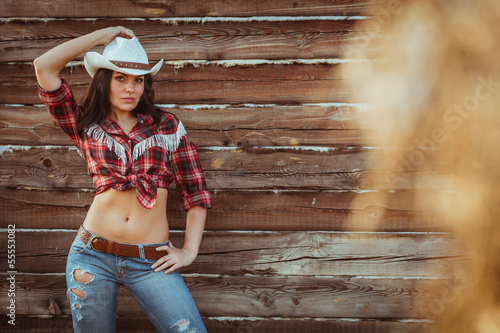 cowgirl model posing on farm photo