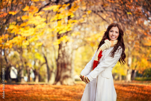 Young woman in beautiful autumn park
