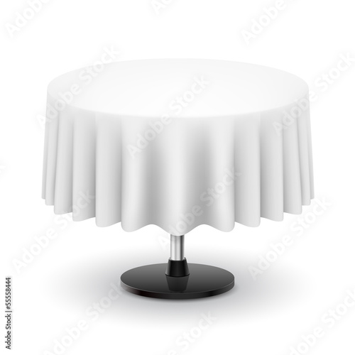 Round table with white cloth.