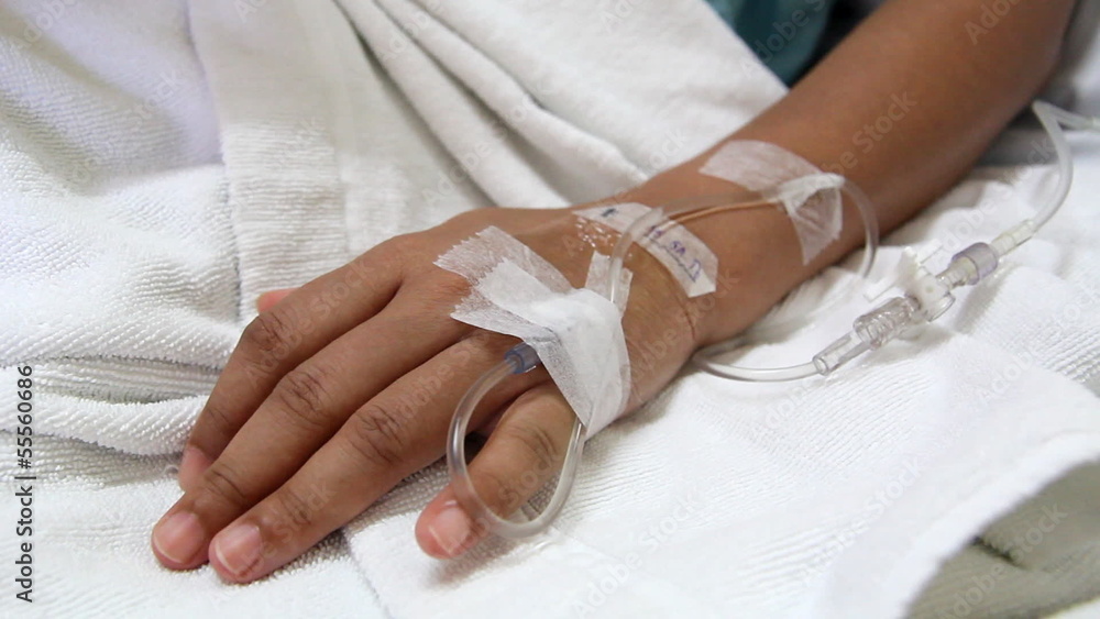 Close Up Hand of Young Patient with Intravenous Catheter for Injection Plug in H