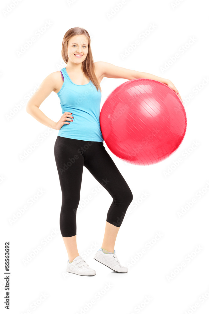 Full length portrait of a young female athlete holding a fitness Full length portrait of a young female athlete holding a fitness