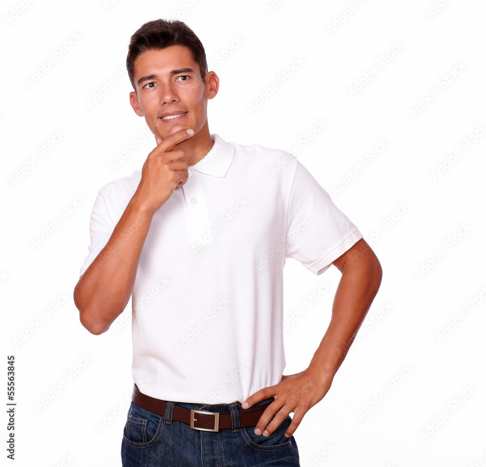 Hispanic man in white t-shirt looking reflective. Hispanic man in white t-shirt looking reflective.