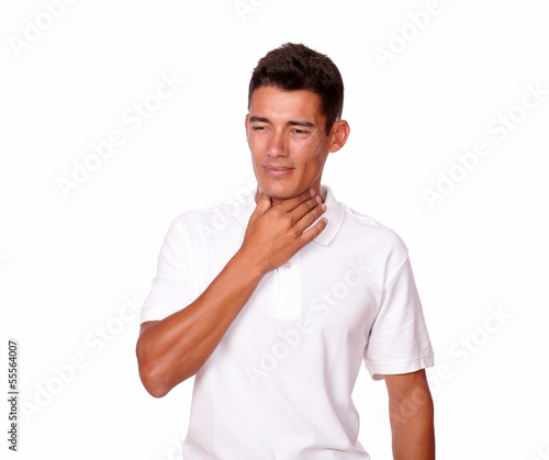 Attractive man in white looking sick and tired.