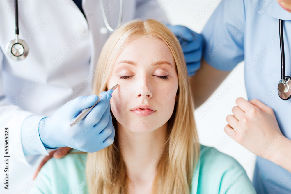 Fototapeta premium plastic surgeon and nurse with patient