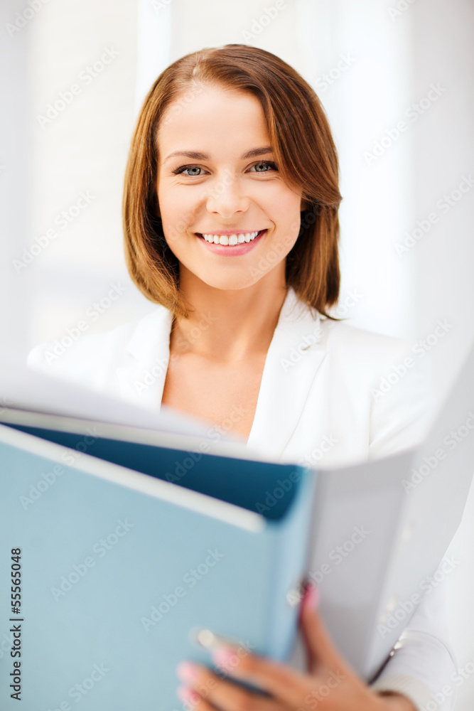 businesswoman with folders in office businesswoman with folders in office