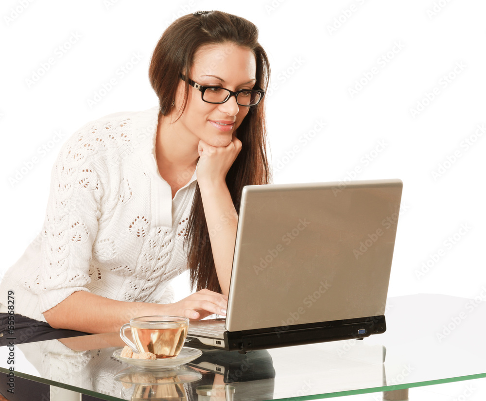A business woman is drinking tea at the desk A business woman is drinking tea at the desk