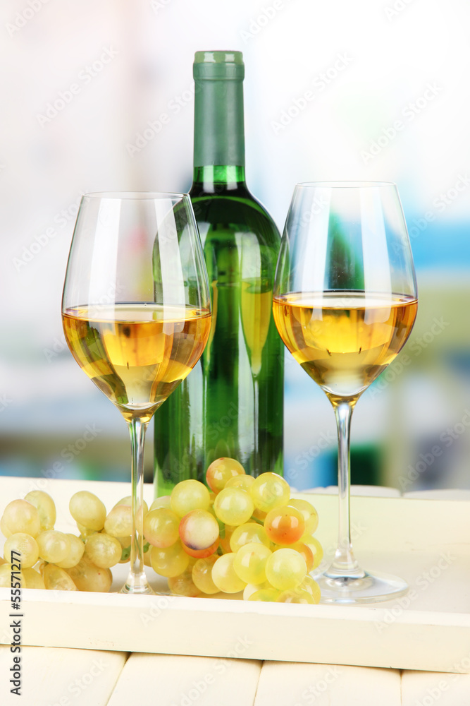 Ripe grapes, bottle and glasses of wine