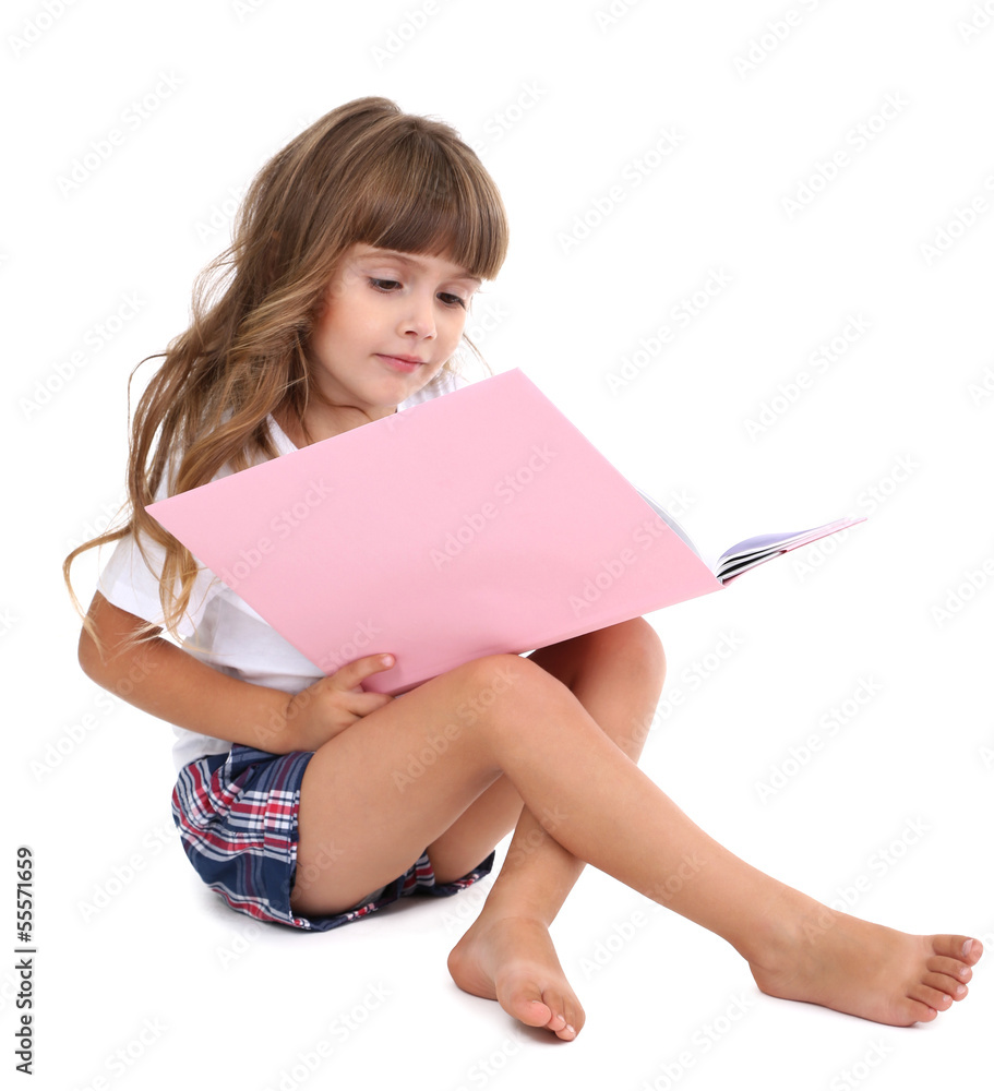 Little girl sitting on floor with book isolated on white Little girl sitting on floor with book isolated on white