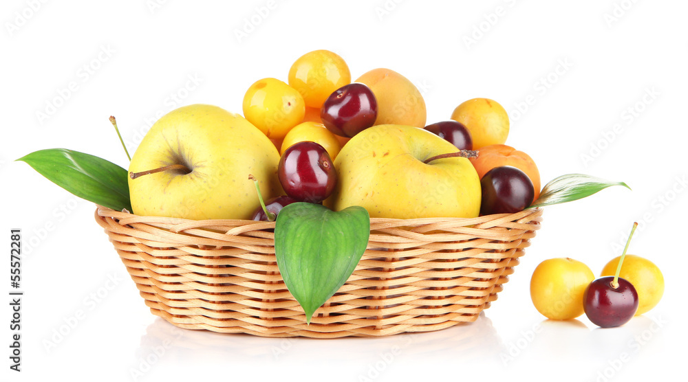 Bright summer fruits in basket isolated on white Bright summer fruits in basket isolated on white