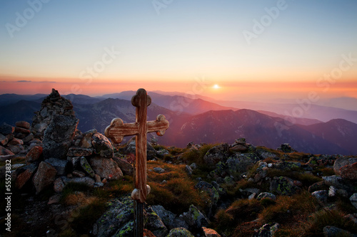 sunset over the wooden cross in the mountains, altar and holly lands concept © Svetoslav Sokolov