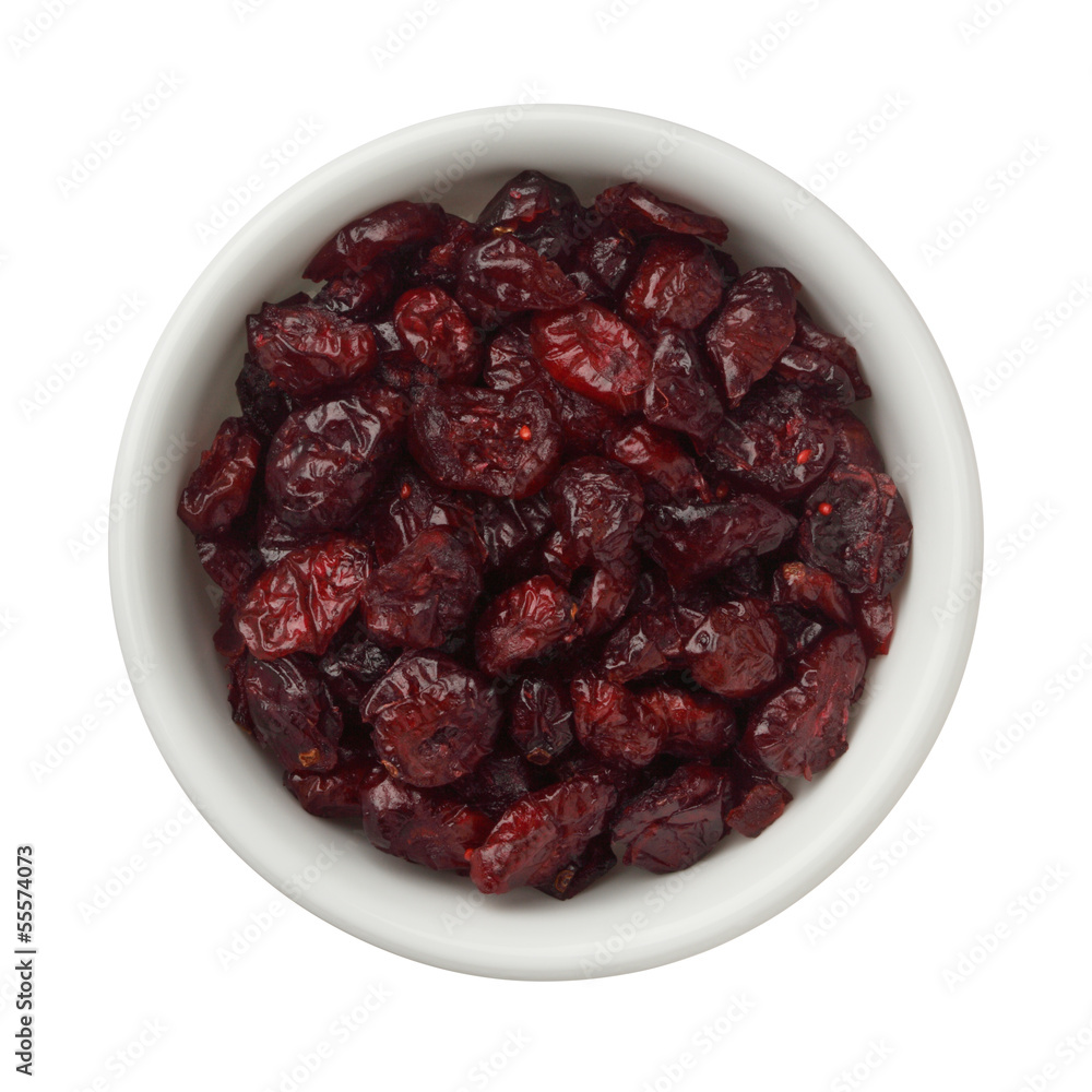 Dried cranberries in a bowl isolated on white background Dried cranberries in a bowl isolated on white background