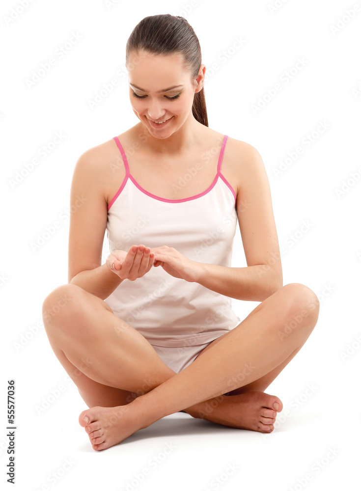 Young woman in night wear sitting on floor Young woman in night wear sitting on floor