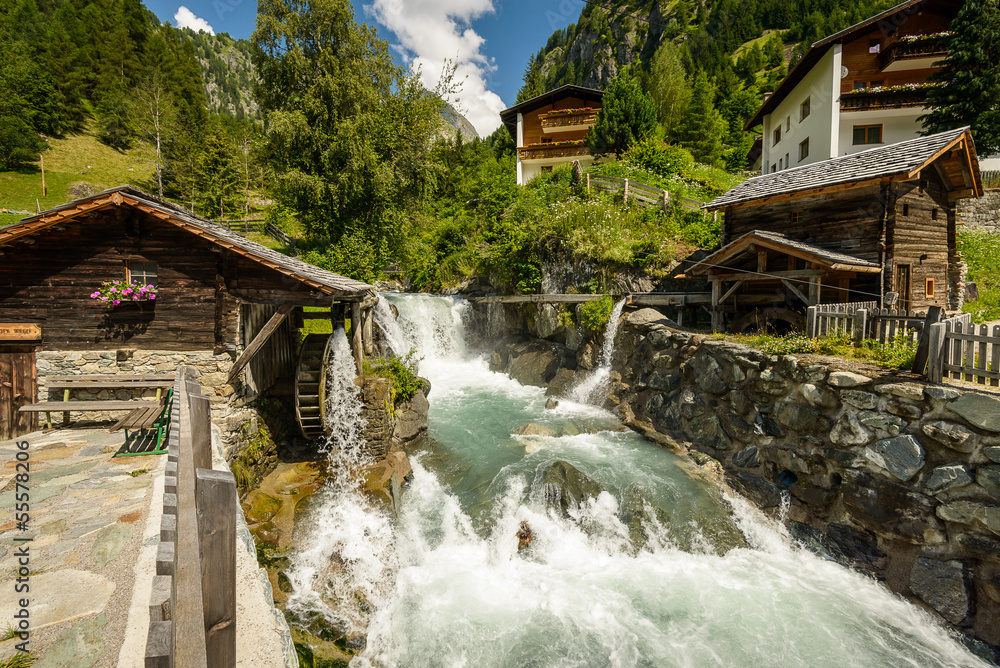 Summer landscape with mill on wild river, Tirol, Austria.
