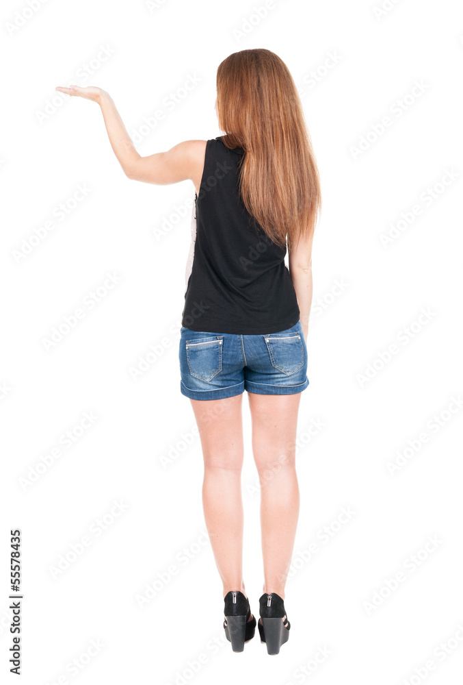 back view of surprised beautiful young redhead woman with hands back view of surprised beautiful young redhead woman with hands