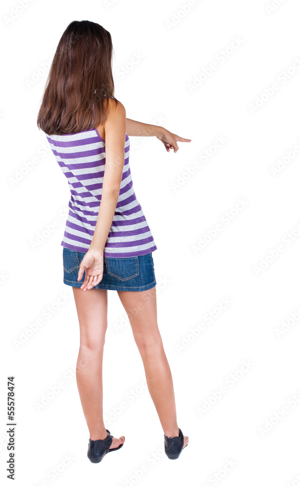 Back view of pointing woman. Back view of pointing woman.