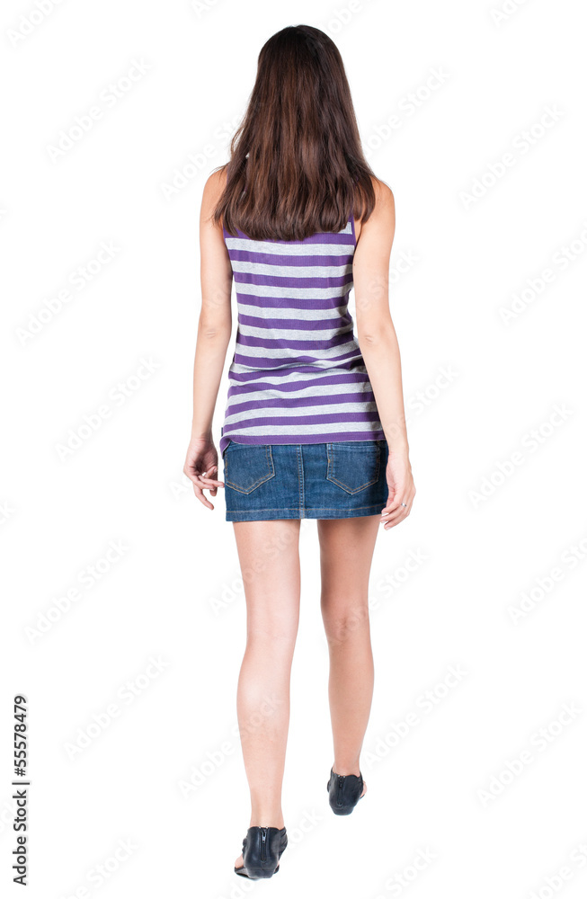back view of walking woman .