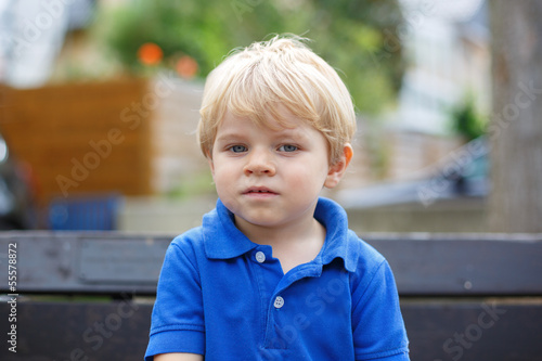 Little cute toddler boy with blond hairs