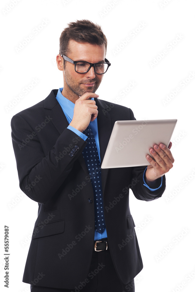 Businessman working on his digital tablet Businessman working on his digital tablet