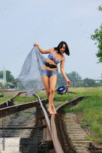 Young girl on the railroad track