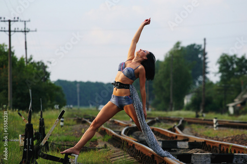 Young girl on the railroad track