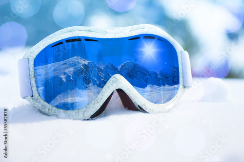 Ski mask close-up and mountain reflection