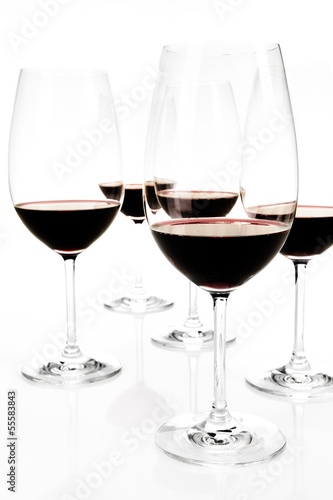 Several Glasses of red wine on white background