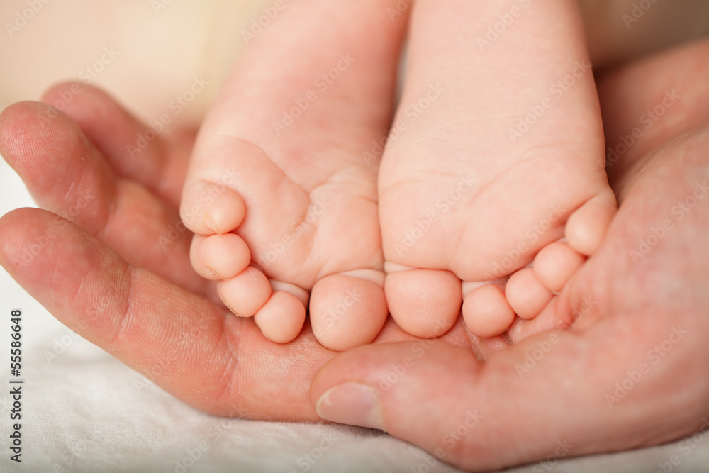 Happiness concept - newborn foot, macro Happiness concept - newborn foot, macro