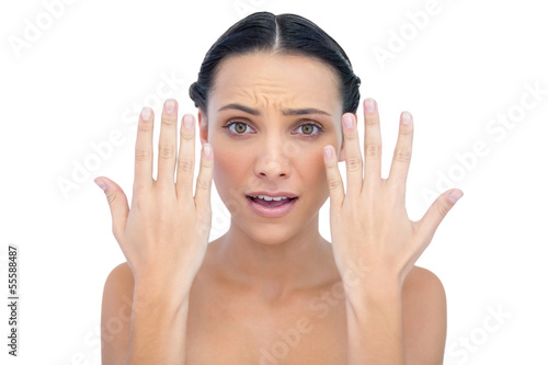 Annoyed natural model posing with hands up