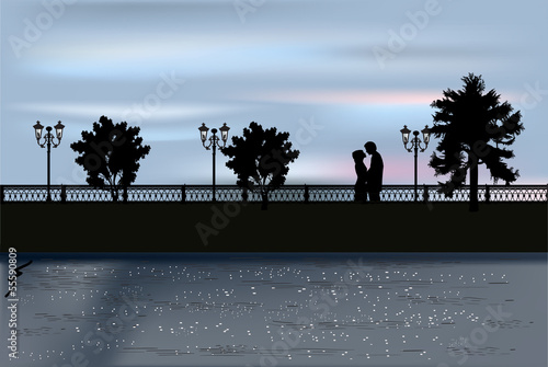couple on quay at sunset