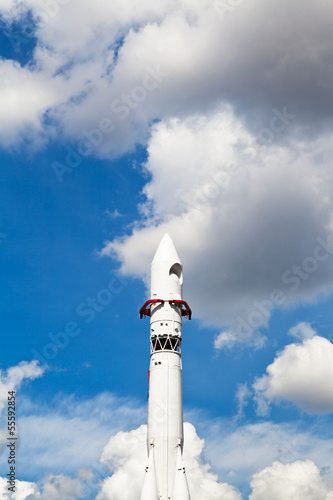 Vostok spacecraft and blue sky with clouds