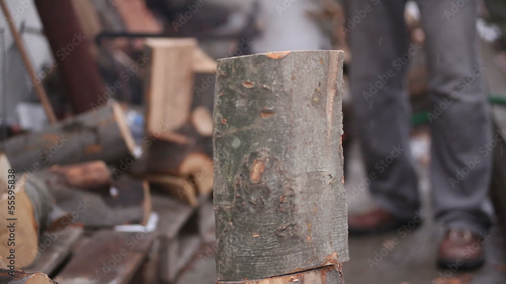 Splitting Firewood With An Axe Splitting Firewood With An Axe