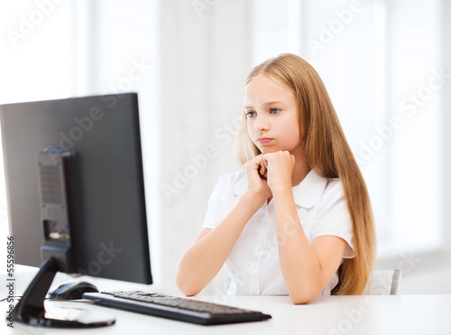 student girl with computer at school