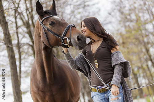 Young woman with a horse © BGStock72