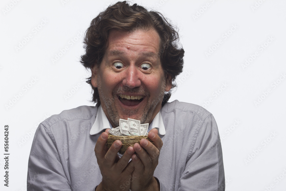 Happy man with money in his hands, horizontal Happy man with money in his hands, horizontal